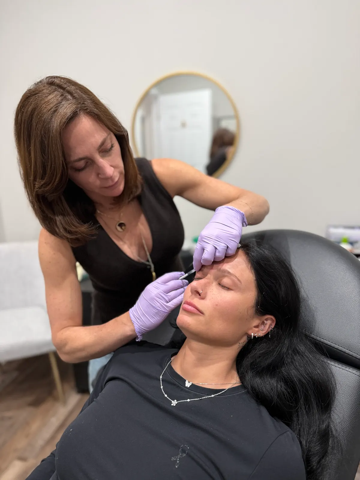 A VITRA Aesthetics Clinic injector treating a patient